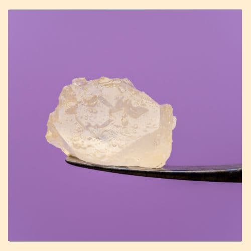 photo of a large cannabis concentrate in diamond form sitting atop a dab tool extracted by Mountaintop Extracts 